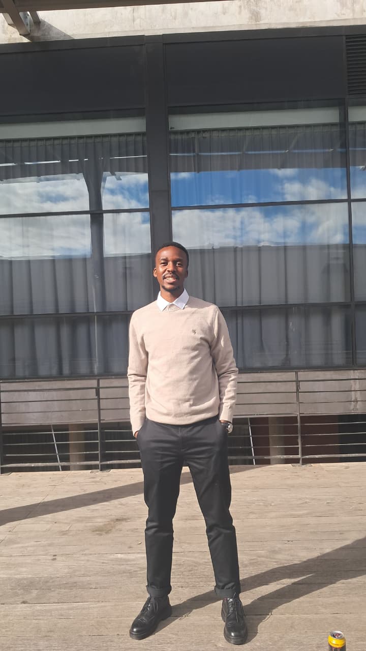 Tsepang Molapo standing outside a university building